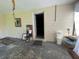 Enclosed patio area with access door and various items at 14810 N 30Th St, Lutz, FL 33559