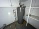 Garage with water heater and storage shelves at 14810 N 30Th St, Lutz, FL 33559