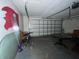 Garage with door, table, and chairs at 14810 N 30Th St, Lutz, FL 33559