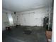 Garage with pegboard walls and a water heater at 14810 N 30Th St, Lutz, FL 33559