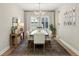 Spacious dining room featuring a large table and stylish rug at 14838 Paddock Pond Ave, Lithia, FL 33547