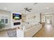 Bright living room with fireplace and hardwood floors at 14838 Paddock Pond Ave, Lithia, FL 33547