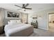 Bright main bedroom with a king-size bed and ensuite bathroom at 14838 Paddock Pond Ave, Lithia, FL 33547