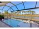 Stunning screened pool with a view of the lake at 14838 Paddock Pond Ave, Lithia, FL 33547