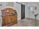 Inviting entryway with rustic wooden cabinet and barn door at 1512 Big Bass Dr, Tarpon Springs, FL 34689