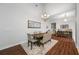 Dining room with a wood table, chandelier, and hardwood flooring at 16130 Craigend Pl, Odessa, FL 33556