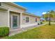 Home exterior with teal front door and walkway at 16130 Craigend Pl, Odessa, FL 33556