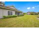 Side view of the house with lush green lawn at 16130 Craigend Pl, Odessa, FL 33556