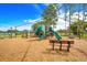 Community playground with playset, slides, and benches at 16130 Craigend Pl, Odessa, FL 33556