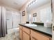 Bathroom featuring a shower-tub combo, a vanity, and neutral tones at 1632 Gray Bark Dr, Oldsmar, FL 34677