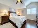 Bedroom featuring hardwood floors, a white comforter, and recessed lighting at 1632 Gray Bark Dr, Oldsmar, FL 34677