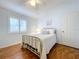 Bright bedroom featuring hardwood floors and large windows at 1632 Gray Bark Dr, Oldsmar, FL 34677