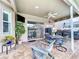 Outdoor patio area with views of the pool, TV and landscaping at 1632 Gray Bark Dr, Oldsmar, FL 34677