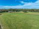 Aerial view of property showing a main house, pasture, and horse at 17120 Boy Scout Rd, Odessa, FL 33556