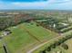 Aerial view of property with riding arena at 17120 Boy Scout Rd, Odessa, FL 33556