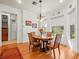 Bright breakfast nook with wood table and four chairs at 17120 Boy Scout Rd, Odessa, FL 33556