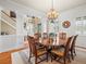 Bright dining room featuring a large octagonal table and chandelier at 17120 Boy Scout Rd, Odessa, FL 33556