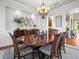 Elegant dining room with octagonal table, chandelier, and decorative mirrors at 17120 Boy Scout Rd, Odessa, FL 33556