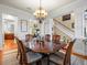 Formal dining room with a large table, chandelier, and hardwood floors at 17120 Boy Scout Rd, Odessa, FL 33556