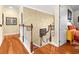 Upstairs hallway with hardwood floors and railing at 17120 Boy Scout Rd, Odessa, FL 33556