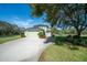 Two-car garage and lush landscaping at 17120 Boy Scout Rd, Odessa, FL 33556