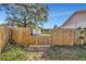 Backyard with wooden fence and storage shed at 1803 Tawnee Pl, Brandon, FL 33510