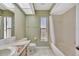 Bathroom featuring a bathtub, tile floors, and a single vanity sink at 1803 Tawnee Pl, Brandon, FL 33510