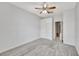 Bedroom with neutral carpet, closet, ceiling fan and natural light at 1803 Tawnee Pl, Brandon, FL 33510