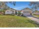 Single-story home with a two-car garage and well-maintained lawn at 1803 Tawnee Pl, Brandon, FL 33510