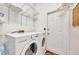 Laundry room with washer, dryer, and shelving at 1803 Tawnee Pl, Brandon, FL 33510