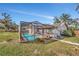 Backyard view of a screened-in pool offering relaxation and outdoor enjoyment at 1803 Tawnee Pl, Brandon, FL 33510