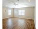 Large bedroom with hardwood floors and ceiling fan at 18209 Tivoli Ln, Lutz, FL 33558