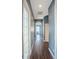 Bright hallway with wood-look floors and neutral walls at 18209 Tivoli Ln, Lutz, FL 33558