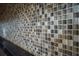 Close-up of a kitchen backsplash with a mosaic tile pattern at 18209 Tivoli Ln, Lutz, FL 33558