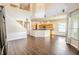 High-ceilinged living room with hardwood floors and an open floor plan at 18209 Tivoli Ln, Lutz, FL 33558