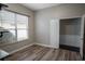 Home office with wood-look floors and built-in shelving at 18209 Tivoli Ln, Lutz, FL 33558