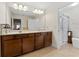 Double vanity bathroom with a large walk-in shower at 19231 Pepper Grass Dr, Tampa, FL 33647