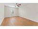 Bedroom with hardwood floors and ceiling fan at 19231 Pepper Grass Dr, Tampa, FL 33647