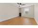 Spacious bedroom with hardwood floors and ceiling fan at 19231 Pepper Grass Dr, Tampa, FL 33647