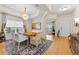 Bright dining room with wood table, chandelier, and view to entryway at 19231 Pepper Grass Dr, Tampa, FL 33647