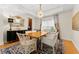 Elegant dining room with wood table, chandelier, and patterned rug at 19231 Pepper Grass Dr, Tampa, FL 33647