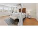 Main bedroom with canopy bed and hardwood floors at 19231 Pepper Grass Dr, Tampa, FL 33647