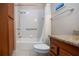 Clean bathroom, shower/tub combo, wood vanity, and granite countertop at 1937 Sterling Glen Ct, Sun City Center, FL 33573