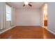 Bright bedroom with hardwood floors and ceiling fan at 1937 Sterling Glen Ct, Sun City Center, FL 33573