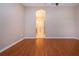 Well-lit bedroom featuring hardwood floors and an ensuite bathroom at 1937 Sterling Glen Ct, Sun City Center, FL 33573