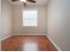 Bright bedroom with hardwood floors and window with blinds at 1937 Sterling Glen Ct, Sun City Center, FL 33573