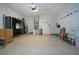 Spacious garage with ample storage shelving and room for two cars at 1937 Sterling Glen Ct, Sun City Center, FL 33573