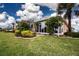 House exterior showcasing manicured lawn and landscaping at 1937 Sterling Glen Ct, Sun City Center, FL 33573