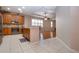 Kitchen features wood cabinets, granite counters, and stainless steel appliances at 1937 Sterling Glen Ct, Sun City Center, FL 33573