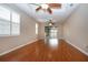 Spacious living room with hardwood floors and sliding glass doors at 1937 Sterling Glen Ct, Sun City Center, FL 33573